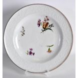 AN 18TH CENTURY MEISSEN PORCELAIN PLATE painted with floral sprays under a moulded border. 8.75ins