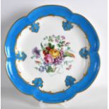 AN 18TH CENTURY SEVRES PORCELAIN SCALLOPED CABINET PLATE painted with a spray of flowers. 11Ins