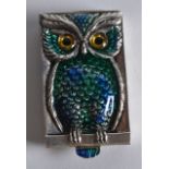 A SILVER ENAMEL 'OWL' VESTA CASE.