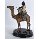 A 19TH CENTURY AUSTRIAN COLD PAINTED BRONZE FIGURE OF A CAMEL modelled with an ethnic huntsman on