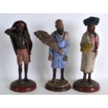 A SET OF THREE LATE 19TH CENTRY INDIAN TERRACOTTA FIGURES Poona District, each upon circular