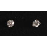 A PAIR OF 18CT GOLD DIAMOND SOLITAIRE EARRINGS.