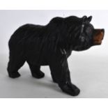 AN EARLY 20TH CENTURY BAVARIAN BLACK FOREST CARVED BEAR modelled in a roaming stance. 10.5ins x 7.