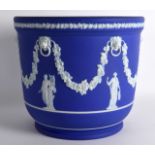 A LARGE 19TH CENTURY WEDGWOOD JASPERWARE JARDINIERE decorated with lion mask heads and classical