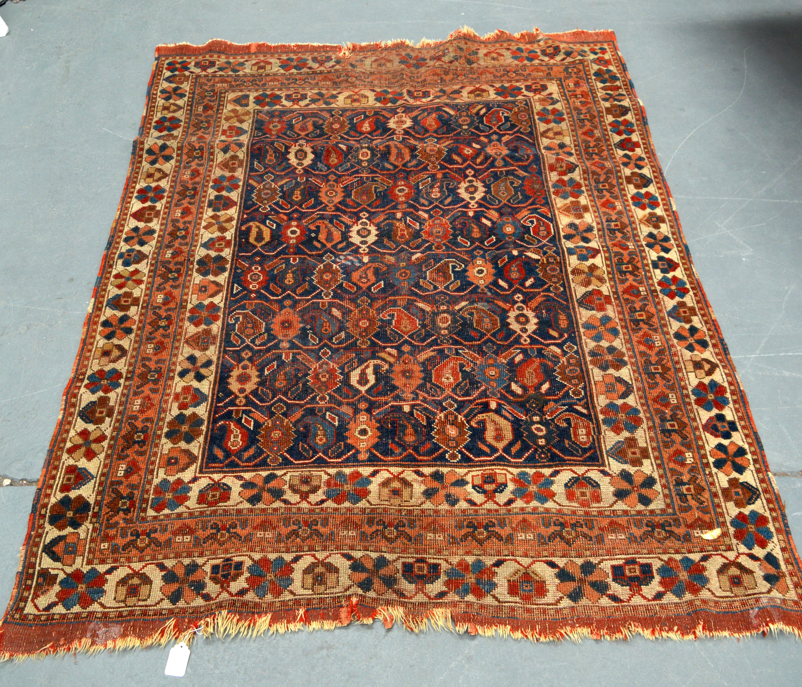 A BLUE AND YELLOW GROUND EASTERN RUG decorated with medallions. 5Ft 4ins x 4ft 1ns.