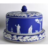 A 19TH CENTURY JAMES DUDSON JASPERWARE ½ STILTON DISH AND COVER decorated with classical figures