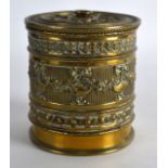 AN EDWARDIAN BRASS CYLINDRICAL THREAD HOLDER decorated with classical urns and swags. 4Ins high.