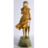 A FINE ART ART NOUVEAU FRENCH BRONZE AND IVORY FIGURE OF A FEMALE elegantly modelled in fur, holding