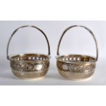 A PAIR OF LATE 19TH CENTURY CONTINENTAL SILVER BASKETS with pierced neo classical design. 4.25ins