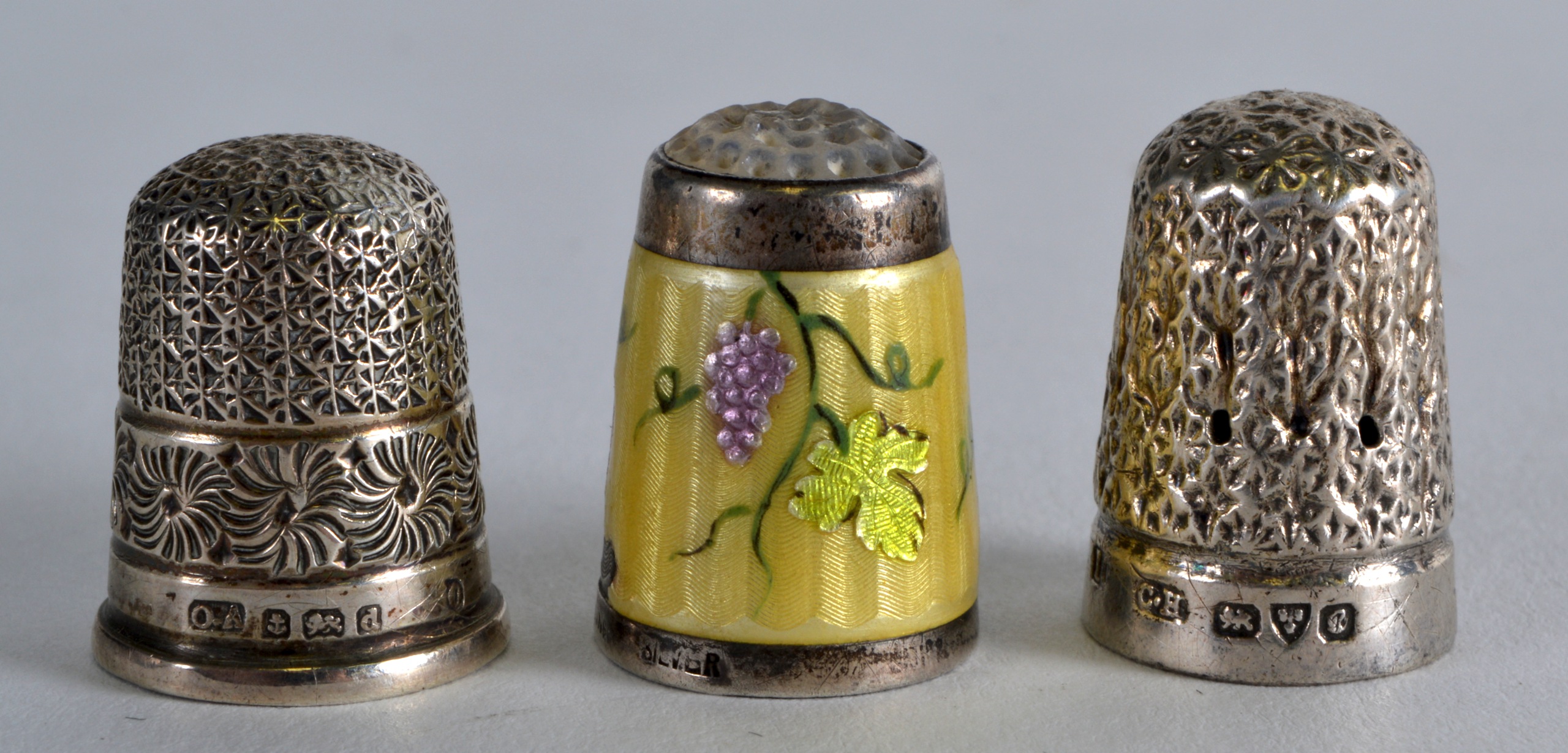 A SILVER THIMBLE by Charles Horner, together with two others. (3)