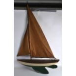 A MID 20TH CENTURY PAINTED SAILING POND YAUCHT with sails. 4Ft x 2ft 6ins.