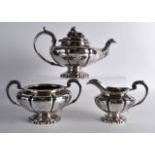 A GOOD LARGE REGENCY SILVER THREE PIECE TEASET with floral cast finial. London 1835. 42oz. (3)