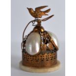 AN EARLY 20TH CENTURY FRENCH MOTHER OF PEARL AND PIERCED BRASS TABLE BELL. 5.5ins high.