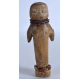 A CARVED SOUTH AMERICAN WOOD DOLL with beadwork mounts. 5.5ins high.