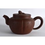 A LATE 19TH CENTURY/20TH CENTURY CHINESE YIXING POTTERY TEAPOT AND COVER incised with calligraphy,