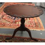 AN ANTIQUE CHIPPENDALE DESIGN FOLDING MAHOGANY TABLE with well carved floral frieze, upon slender