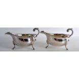 A PAIR OF GEORGE III STYLE SILVER SAUCEBOATS. 16oz. 7Ins wide.