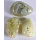 A GROUP OF THREE CHINESE CARVED JADE PEBBLES 20th Century, each formed with a different internal