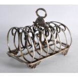 AN EARLY 19TH CENTURY ENGLISH SILVER SIX DIVISION TOAST RACK with acanthus capped handle. 12.5oz.