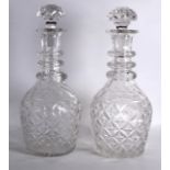 A VERY RARE HUGE PAIR OF ANTIQUE GLASS DECANTERS AND STOPPERS with tripled graduated rings to the