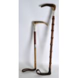 A SILVER MOUNTED RIDING CROP together with another similar. (2)