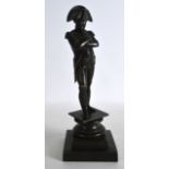 A 19TH CENTURY FRENCH BRONZE FIGURE OF NAPOLEON modelled with arms crossed upon a stepped base. 11.