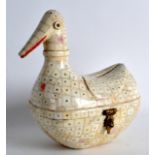 AN EARLY 20TH CENTURY EASTERN CARVED IVORY BIRD BOX AND COVER with iridescent eyes and brass