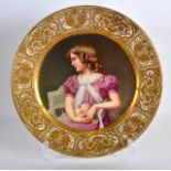 A FINE VIENNA PORCELAIN CABINET PLATE painted by Wagner, depicting a female holding flowers, under a