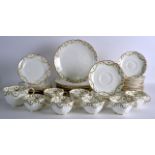 A GEORGE JONES PART PORCELAIN BREAKFAST SERVICE decorated with a floral wreath banding. (qty)