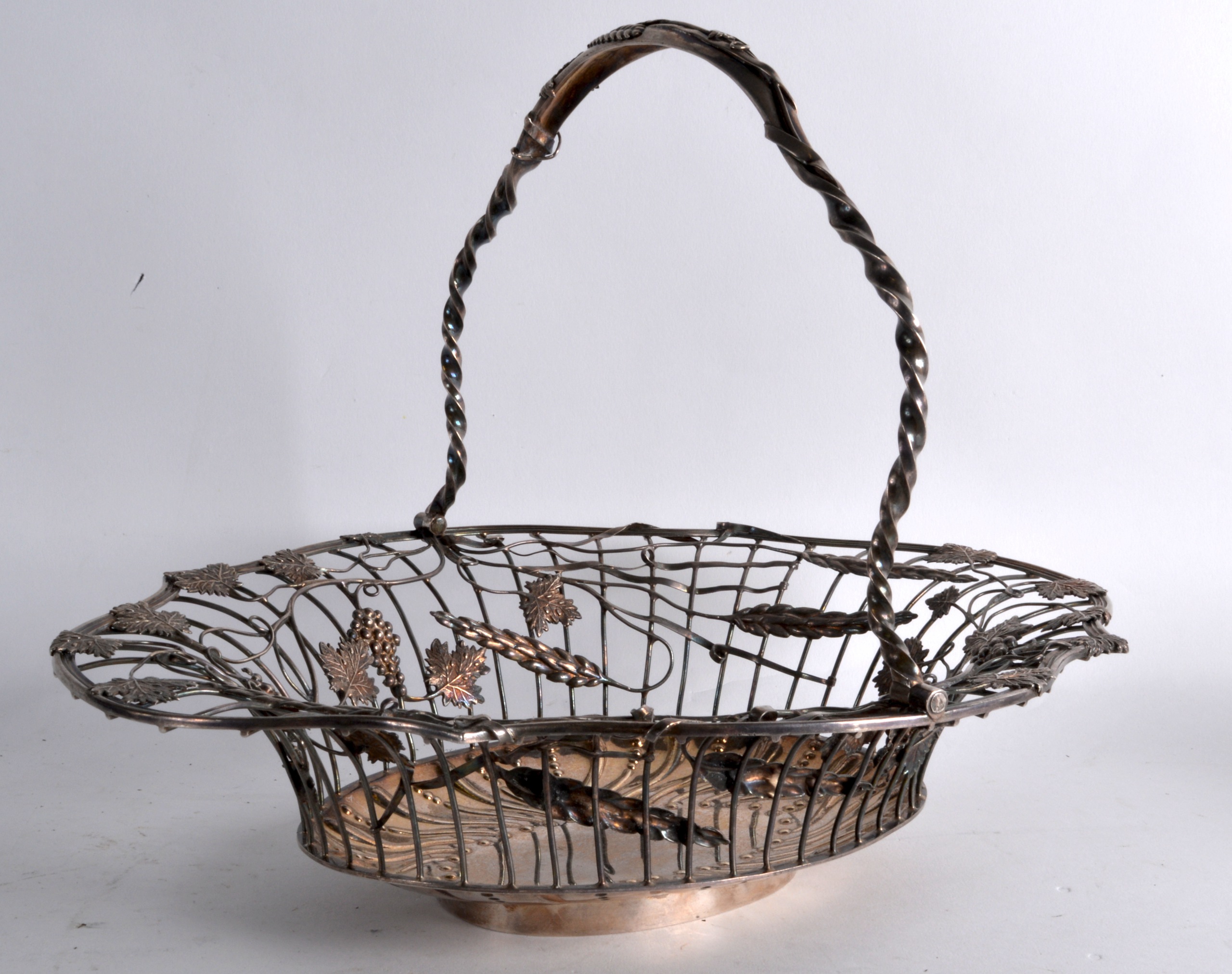 A GOOD MID VICTORIAN SILVER SWING HANDLED BASKET overlaid all over with grape vines, acorn leaves