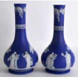 A PAIR OF 19TH CENTURY WEDGWOOD JASPERWARE BULBOUS VASES decorated with classical figures within