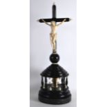 AN UNUSUAL 19TH CENTURY ITALIAN CARVED EBONY AND IVORY REVOLVING CRUCIFIX modelled as christ upon