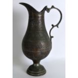 A 19TH CENTURY ISLAMIC COPPER ENGRAVED VESSEl decorated with foliage and motifs. 12Ins high.