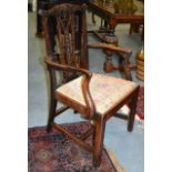 A GOOD GEORGE III CARVED MAHOGANY ELBOW CHAIR with elaborate decoration to arms and back splat.