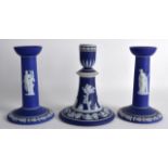 A PAIR OF 19TH CENTURY WEDGWOOD JASPERWARE CANDLESTICKS together with another jasperware