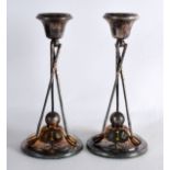 A PAIR OF EDWARDIAN SILVER PLATED 'GOLF CLUB' CANDLESTICKS. 7.5ins high.