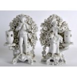 A PAIR OF 18TH/19TH CENTURY HARD PASTE SMOKEY GLAZE BLANC DE CHINE CANDLESTICK FIGURES in the