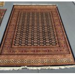 A BLUE GROUND BOKHARA CARPET. 2.8m x 2m.