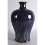 AN 18TH/19TH CENTURY CHINESE FLAMBE GLAZED MEIPING VASE with mottled drip glaze, under a flared