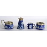 A WEDGWOOD JASPERWARE THREE HANDLED MINIATURE TYG together with a part cruet set etc. (4)