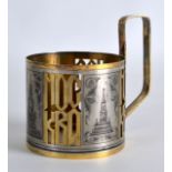 A RUSSIAN WHITE METAL NIELLO PIERCED CUP HOLDER decorated with a clock tower. 3oz.