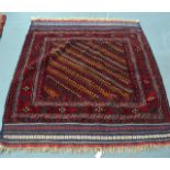 AN UNUSUAL RED GROUND EASTERN RUG decorated with unusual diamond shaped medallions. 4Ft 8ins x 4ft