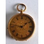 A SMALL EARLY 20TH CENTURY CONTINENTAL 18CT YELLOW GOLD LADIES FOB WATCH engraved with flowers. 1.