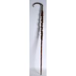 A LATE 19TH CENTURY SILVER PLATED 'SNAKE AND ACORN' WAKING CANE. 2Ft 10ins long.