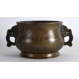 A CHINESE TWIN HANDLED BRONZE CENSER with buddhistic lion mask head mounts, bearing Xuande marks