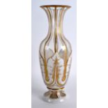 A LATE 19TH CENTURY BOHEMIAN WHITE ENAMEL AND GILT GLASS VASE decorated with foliage. 10.25ins