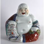 AN EARLY 20TH CENTURY CHINESE FAMILLE ROSE PORCELAIN BUDDHA modelled holding prayer beads, in