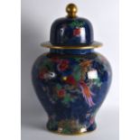 AN EARLY 20TH CENTURY LOSOL WARE LUSTRE GINGER JAR AND COVER decorated with flowers and birds. 1Ft