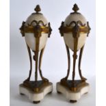 A PAIR OF 19TH CENTURY FRENCH MARBLE AND ORMOLU ORNAMENTS modelled with mask head mounts. 11.5ins