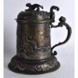 A MID 19TH CENTURY CONTINENTAL SILVER TANKARD AND COVER decorated with bear hunting scenes, with